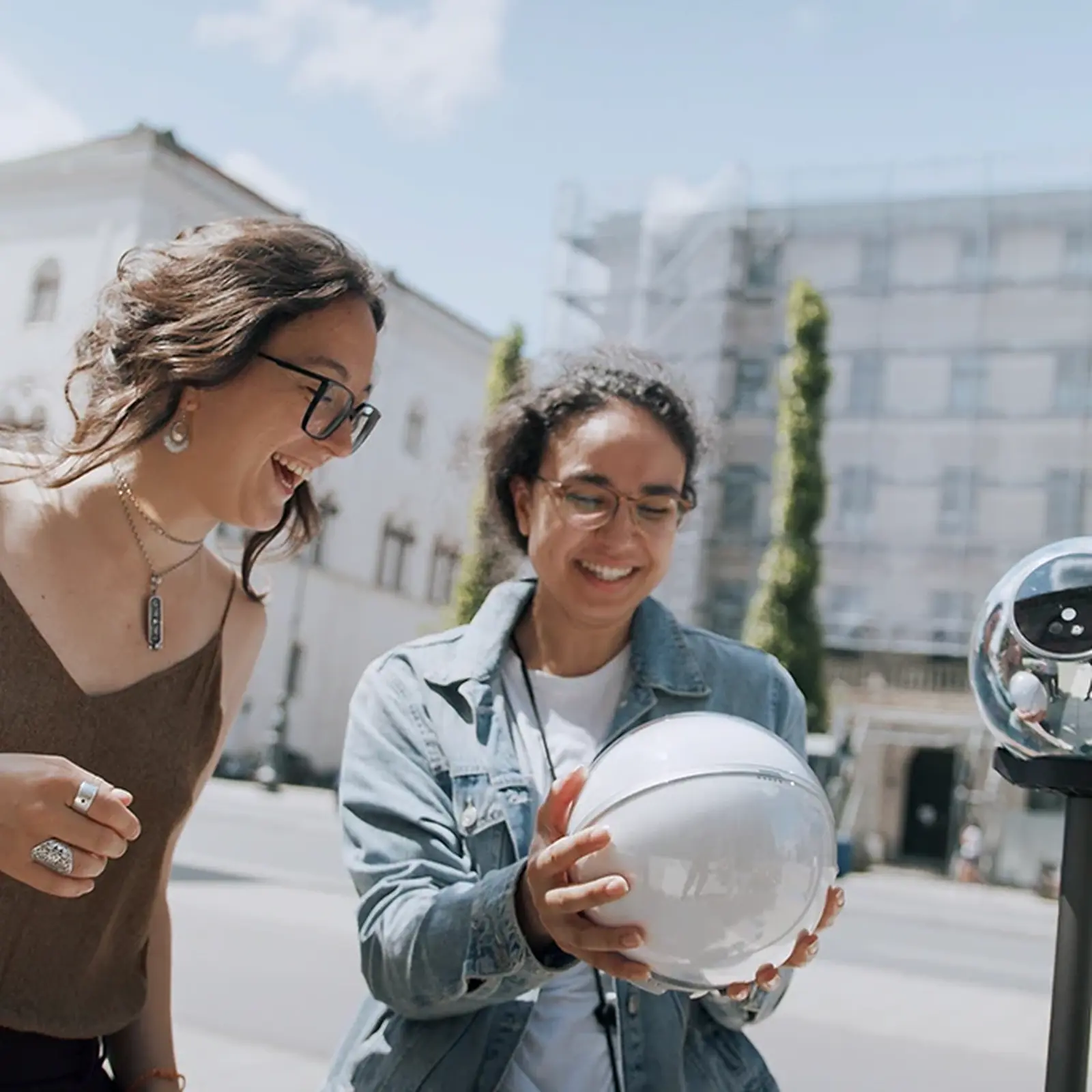 Two visitors verifying with an Orb