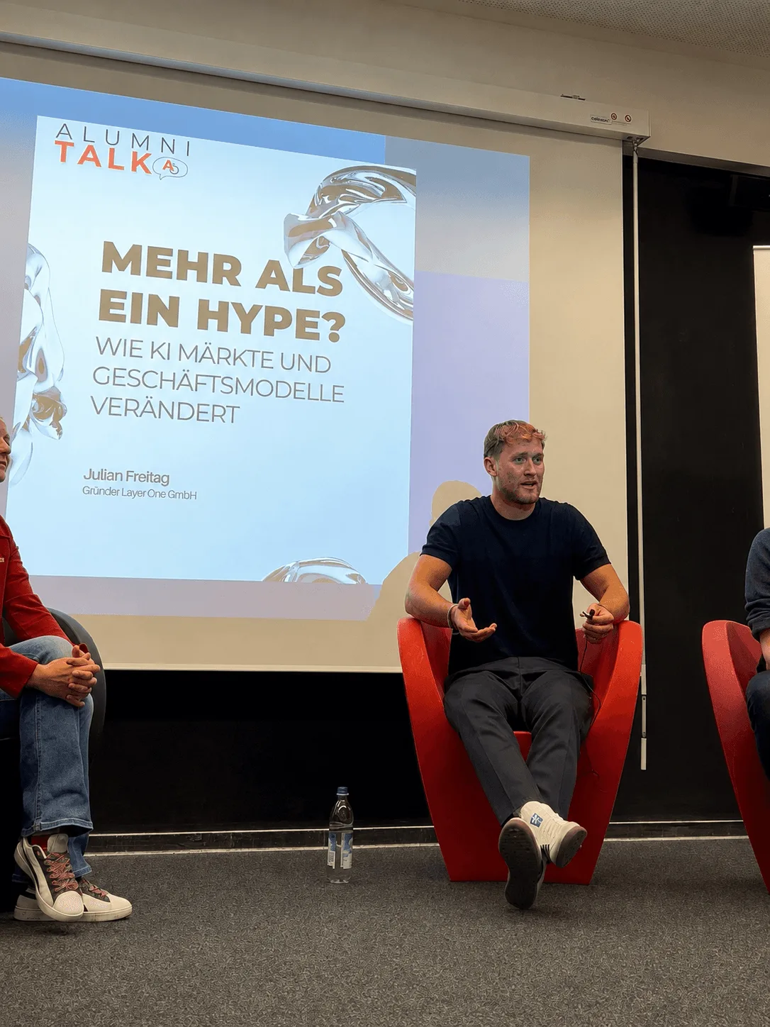 Julian Peer Freitag on an Alumni Talk panel discussing how AI is changing markets and business models